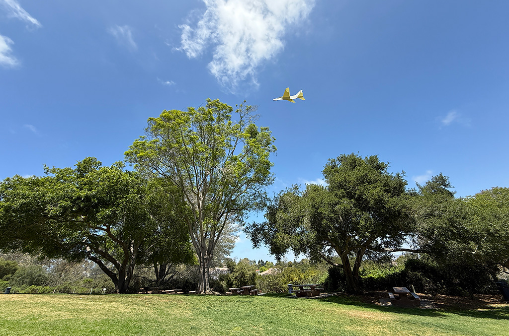 Whitewings paper airplane flying through the air